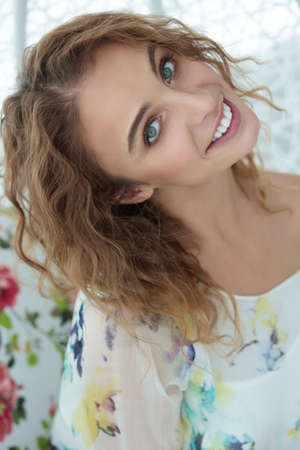 Close-up portrait. Beautiful woman with a happy smile. Natural makeup. Lifestyle.の写真素材