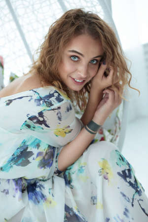 Beautiful smiling woman in the interior. Natural. Lifestyle.の写真素材