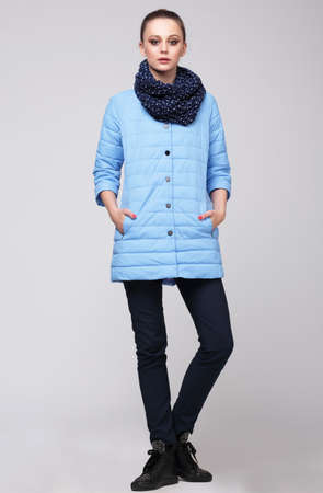 Young woman posing in full growth. Blue Jacket, full-length.の写真素材