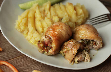 Baked chicken rolls with mashed potatoes.の写真素材