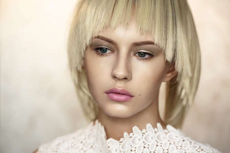 Portrait of a young beautiful woman in profile. White hair. Short haircut. Bob hairstyle.の写真素材