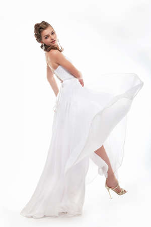 Young woman a bride in a full-length. Isolated in a studio.の写真素材