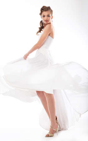 Young woman a bride in a full-length. Isolated in a studio.の写真素材