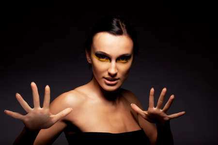 Woman hypnotizes. Magician.の写真素材