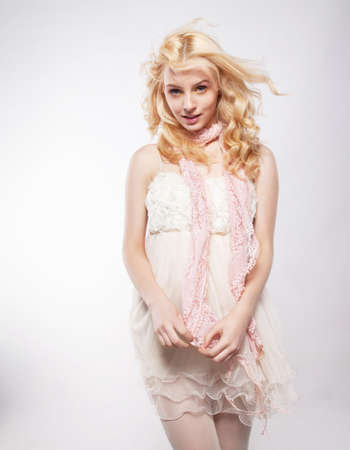 Young beautiful woman in a light dress. Motion.の写真素材