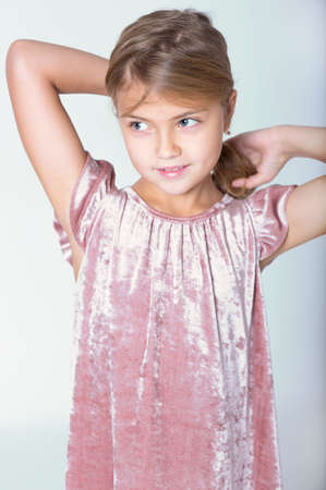 Cute girl makes the tail out of her hair. Do hair.の写真素材