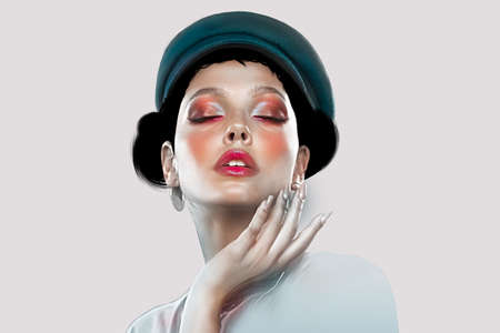 Portrait of a woman with closed eyes and wearing a cap. Beautiful makeup, fingers near the face. Art.の写真素材