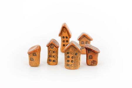 Small clay homes on white backgroundの写真素材