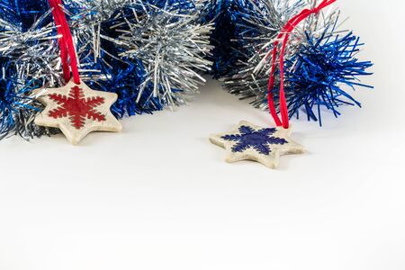 New year celebration design concept on white background with two ceramic snowflakes.の写真素材