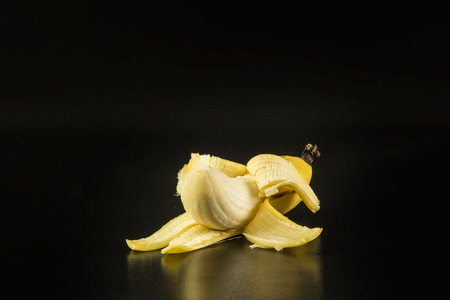 Banana fruit on the black background.の写真素材