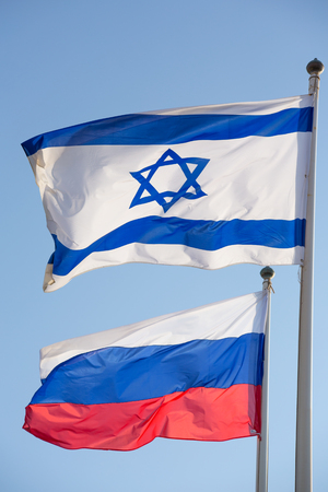 Russain Israel flags together symbol of friendship of two countries.の写真素材