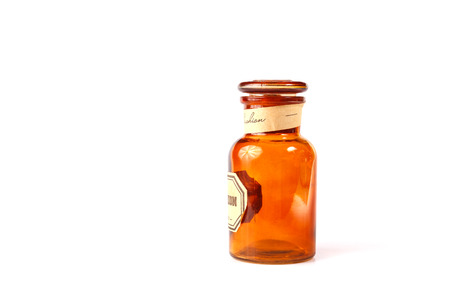 Vintage glass vial, bottle on white background.の写真素材