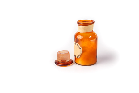 Vintage glass vial, bottle with white salt on white background.の写真素材
