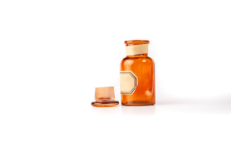 Vintage glass vial, bottle on white background.の写真素材