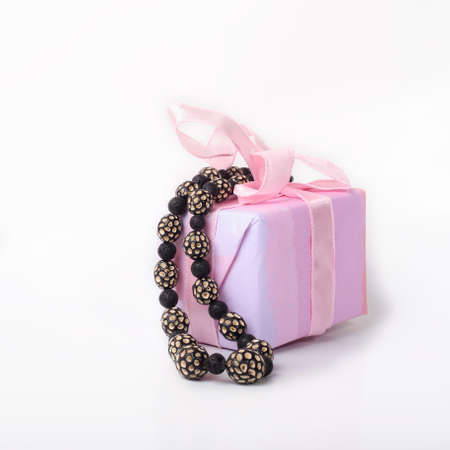 Gift box with black ceramic beads, boho style.の写真素材