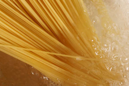 The spaghetti was put in boiling water. Close-upの写真素材