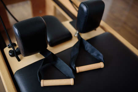 Reformer pilates studio machine for fitness workouts in gym.の写真素材