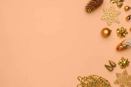 Christmas, winter composition. Layout of golden christmas decorations on beige background. Flat lay, top view, copy space. Concept of christmas, winter, new year.Christmas wallpaper.の写真素材