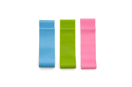 Set of elastic bands for fitness isolated on white. Three fitness bands of different resistance...
