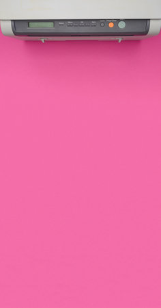 Top view,banner of an office printer on a pink background.Copy space.Office equipment.