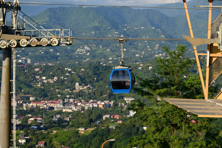 Cable car tour, cabin gliding over city and offering panoramic views of the city and mountains....