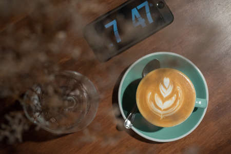 Hot Latte with digital clockの写真素材