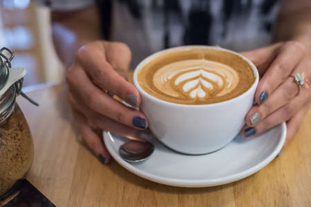 Holding Hot latteの写真素材