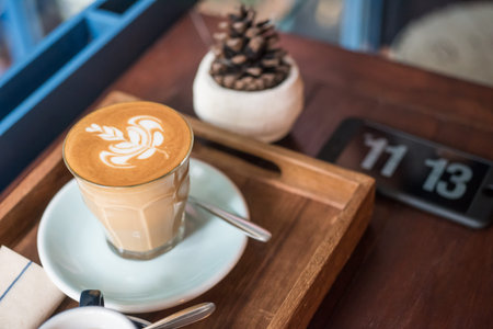 Hot Latte On Wooden Plate with Time
