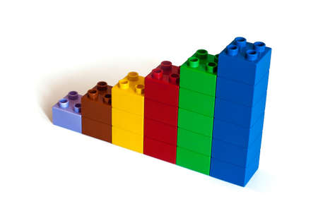 Growing bar chart from color toy blocks isolated on white backgroundの写真素材