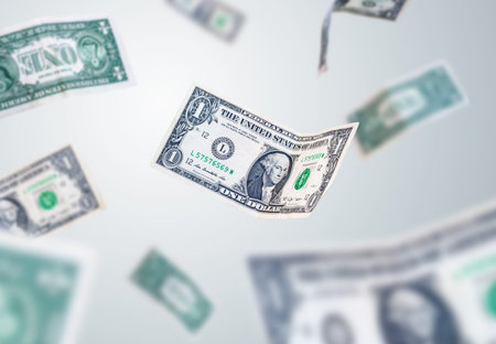 dollar bills falling to the ground