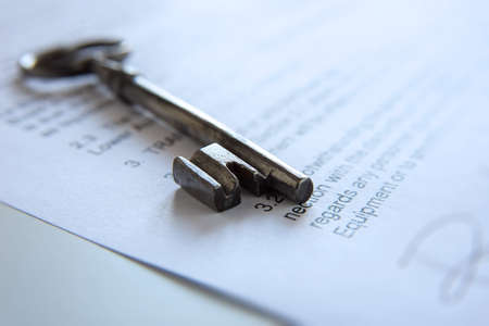Old key on a contractの写真素材