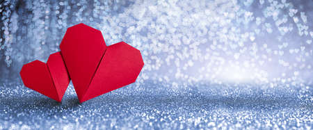 Valentines Day Incoming - Origami Hearts On Shiny Backgroundの写真素材