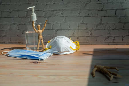 People should use corona virus (Covid 19) prevention set (medical mask and sanitizer gel) for protect your life. Manikin represent concept.の写真素材