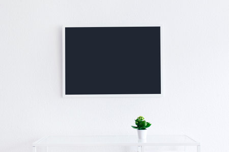 Modern clean interior with blackboard on the wall blank screen and frame