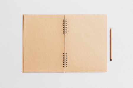 Blank open note with pencil, clean mock upの写真素材