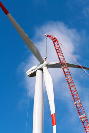 Wind turbine under construction with a crane