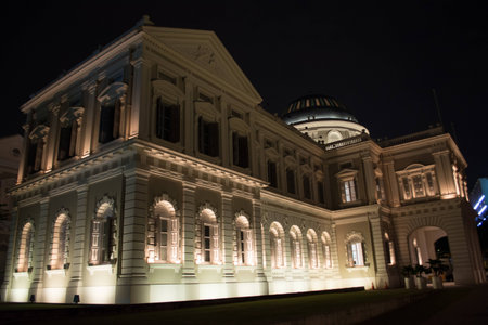 Lit up victorian-style building of singapore s national museum at nightのeditorial素材
