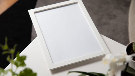 Blank picture frame on a white table in the living room.