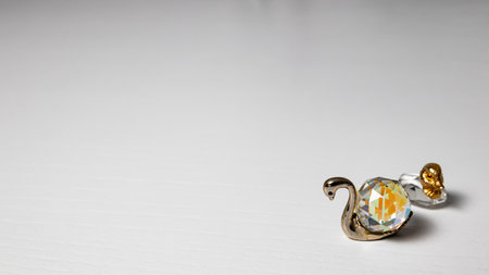 Jewelry ducks with gemstone on white background. Macro shot.の写真素材