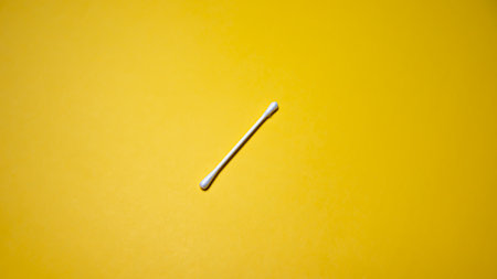 Cotton swab on a yellow background. Close-up.の写真素材