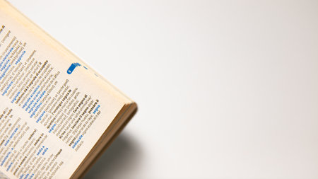 Close up of a book on a white background with space for textの写真素材