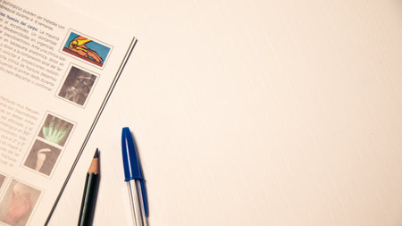 A book with a blue pen next to it and a pen with space for text. Space for studyの写真素材