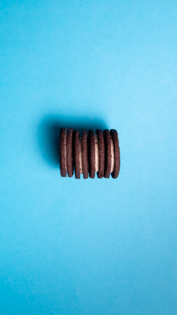 Chocolate cookies on a blue background, top view, copy spaceの写真素材