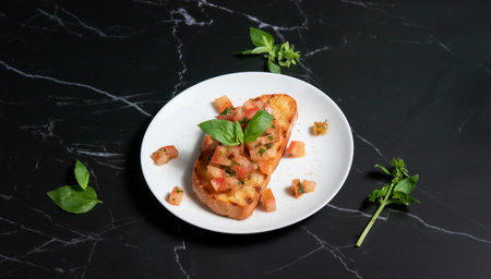 Bruschetta with tomato, basil and parmesan cheeseの写真素材