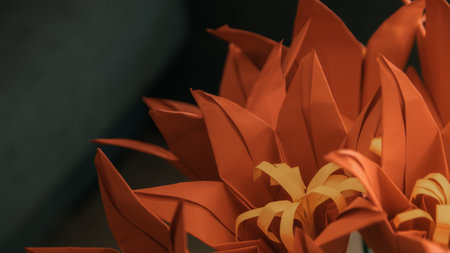Orange origami flower bouquet on black background. Close up.の写真素材