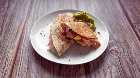 Tortilla with ham, cheese and guacamole.の写真素材
