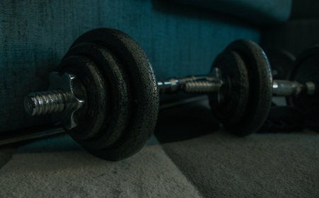 dumbbells on the carpet in the gym, close upの写真素材