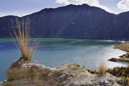 Blue green lake in Quilotoa Volcano, Ecuador taken in early morningの写真素材