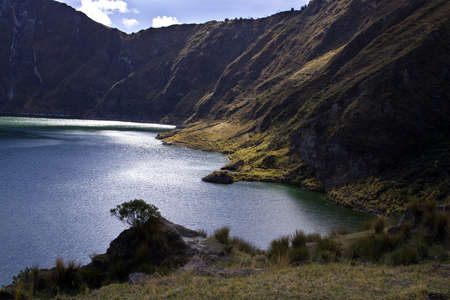 Blue green lake in Quilotoa Volcano, Ecuador taken in early morningの写真素材