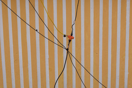 electrical connection suspended in air with orange plug and sockets, bad